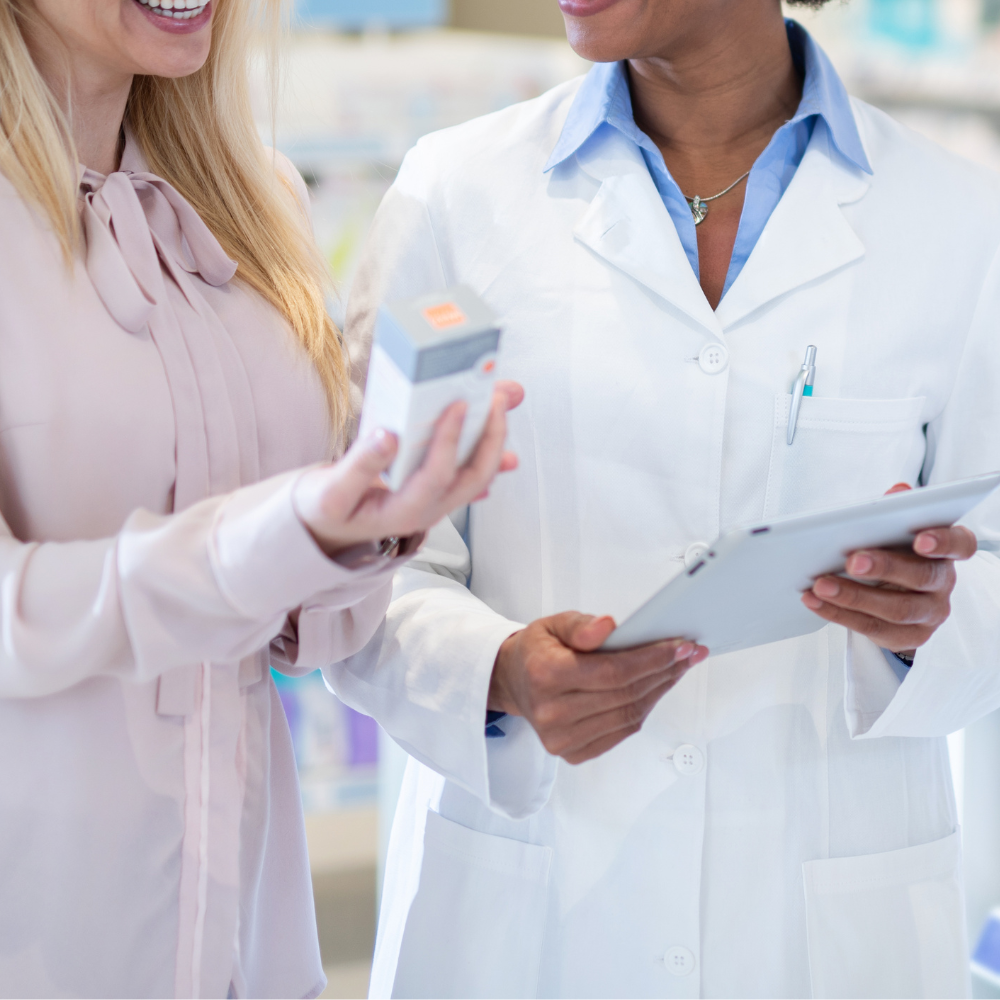 Pharmacist providing medication consultation at a 99pharmacy branch.