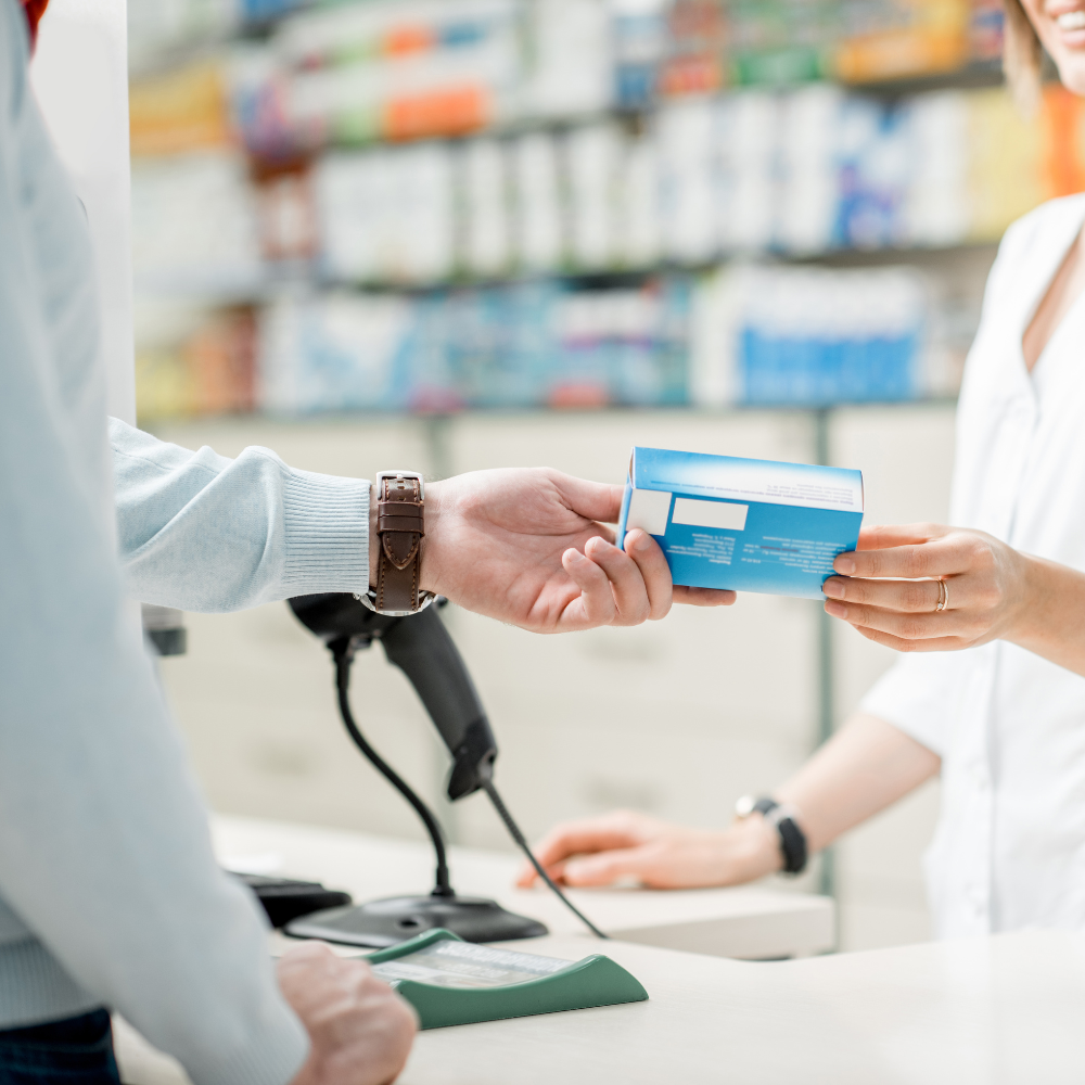 A customer choosing over-the-counter medicines at a 99pharmacy branch.